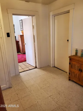 an entryway with a wardrobe space