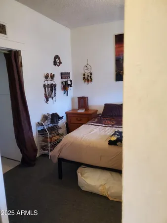 a bedroom with furniture and a window