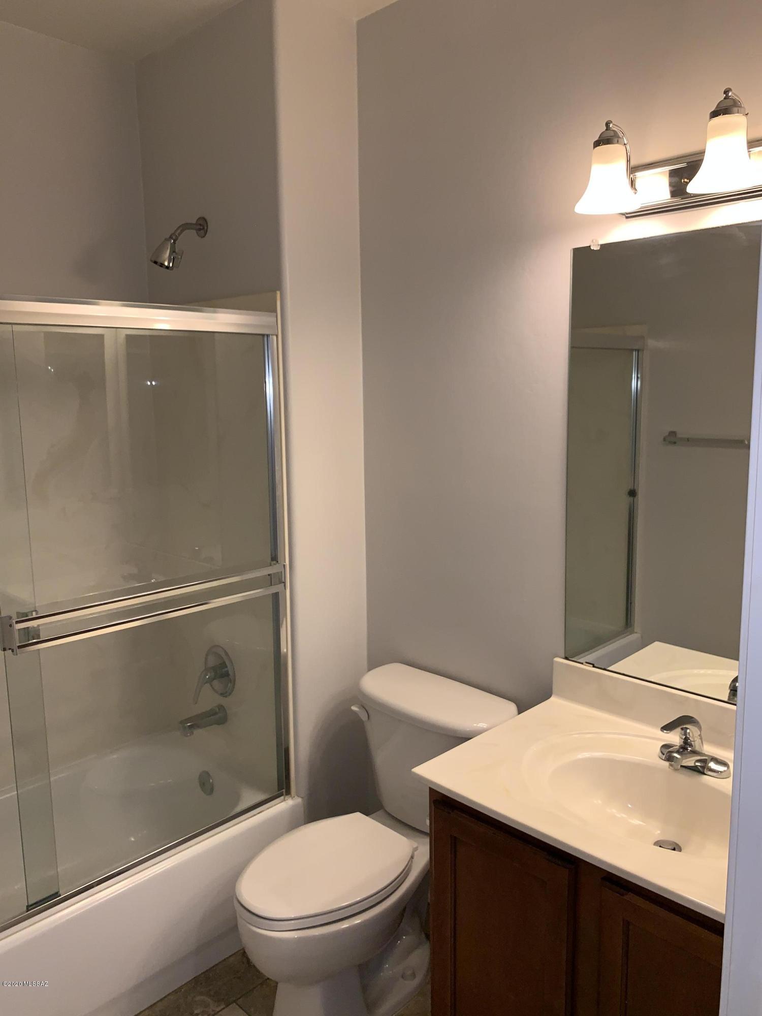 4181 North Fortune Loop Tucson, AZ 85719 - Photo 23 of 39 a bathroom with a sink a toilet and shower
