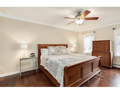 21 Valley View Circle Rutland, MA 01543 - Photo 18 of 40 a bedroom with a bed and a chandelier