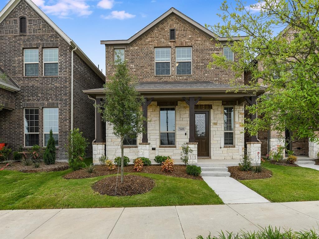 7609 Sunset Boulevard Rowlett, TX 75088 - Photo 1 of 1 a front view of a house with a yard