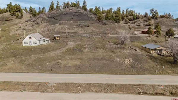 a view of a road with a dry yard