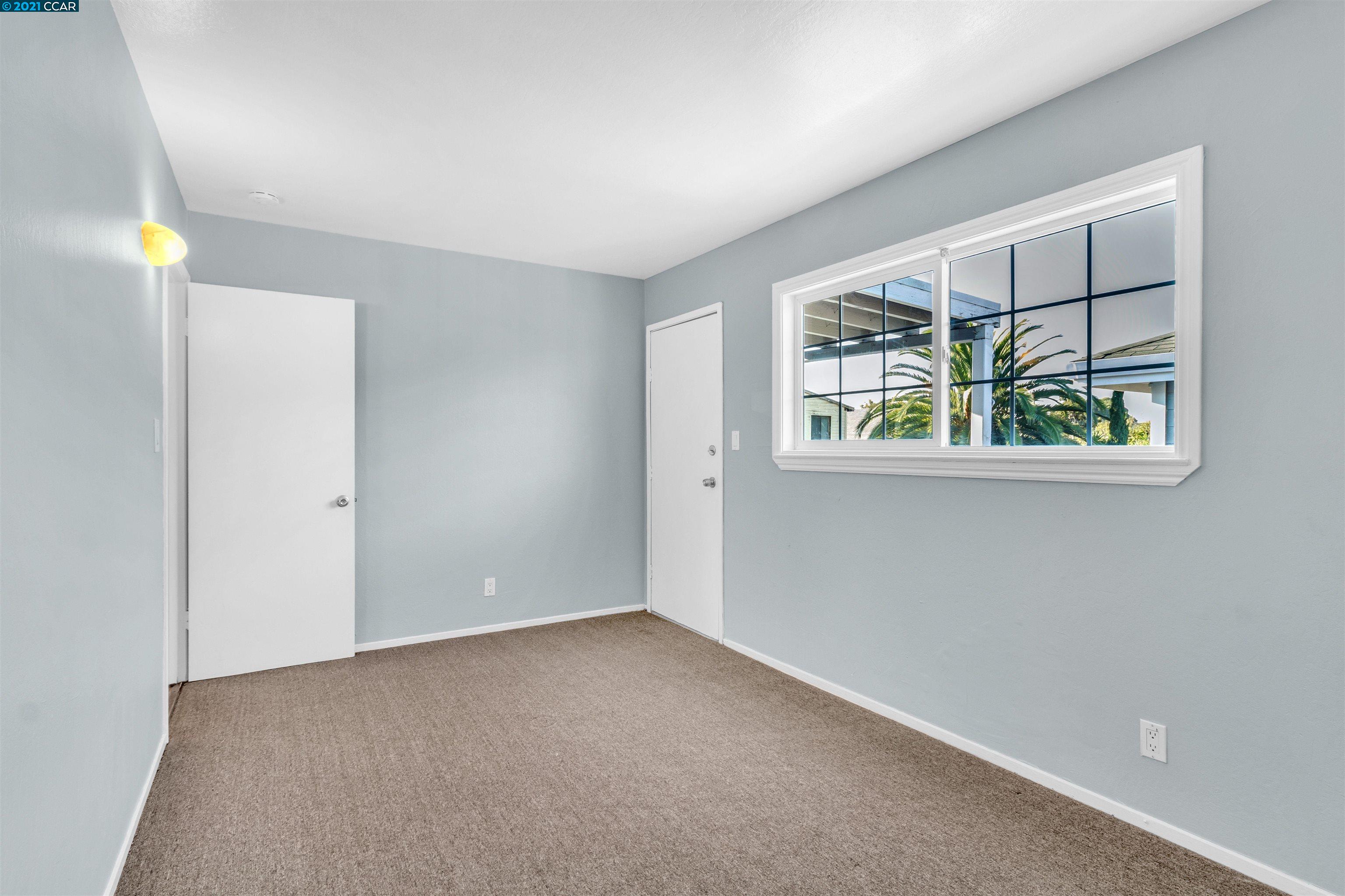 Herbert Guice Way Oakland, CA 94621 - Photo 30 of 40 an empty room with windows and entrance