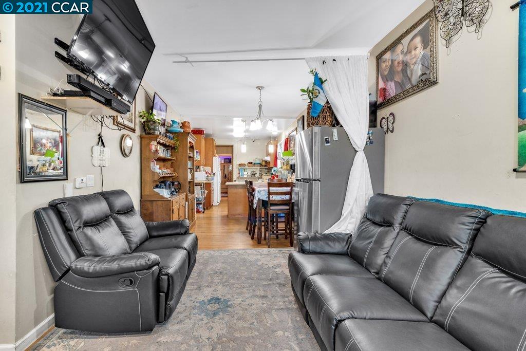Herbert Guice Way Oakland, CA 94621 - Photo 32 of 40 a living room with furniture and a wooden floor