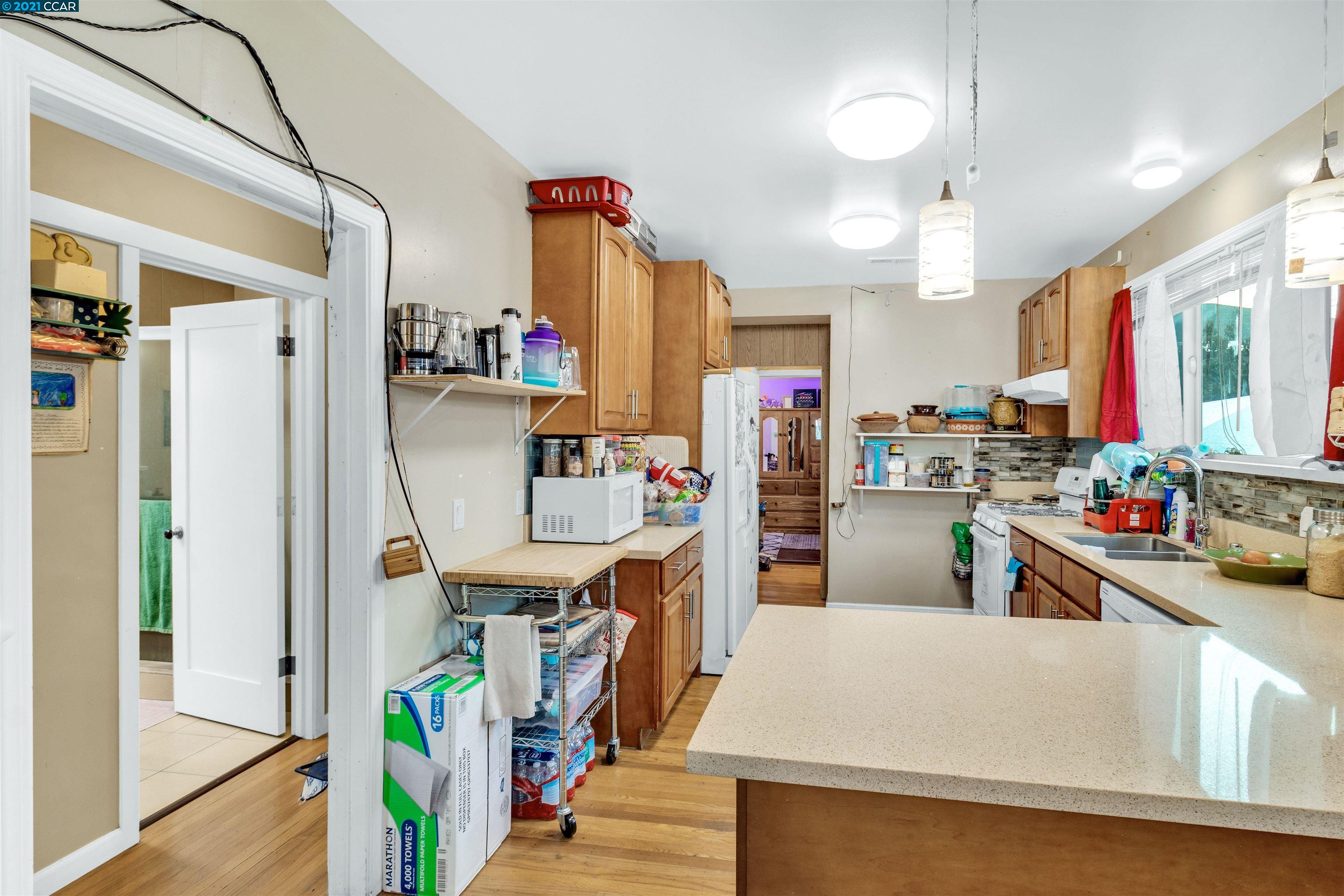 Herbert Guice Way Oakland, CA 94621 - Photo 34 of 40 a room with lots of wooden furniture and a window