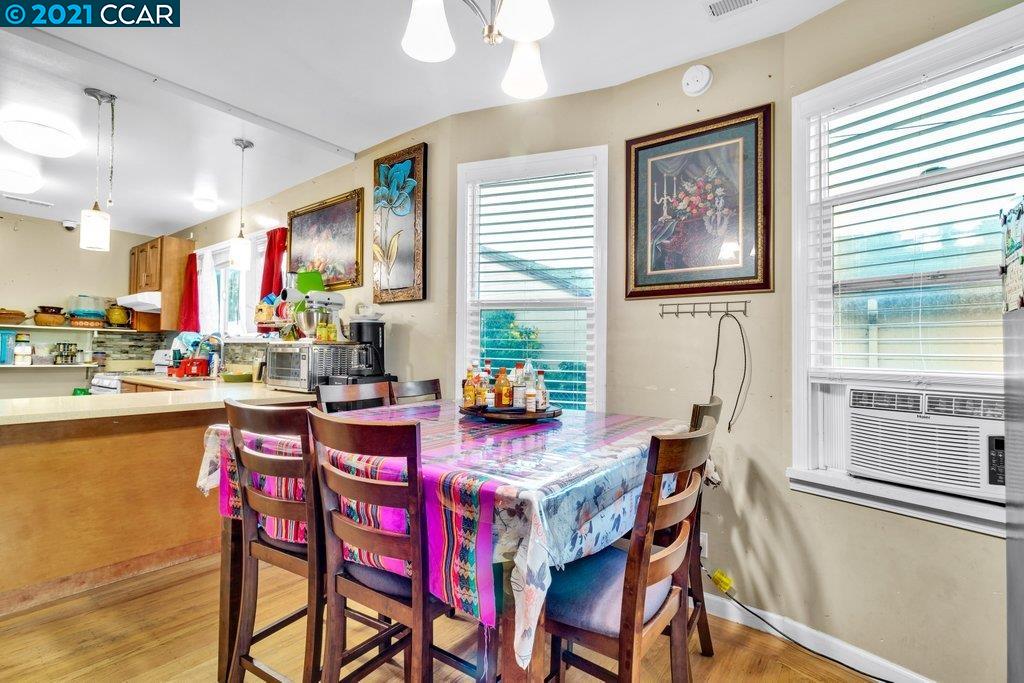 Herbert Guice Way Oakland, CA 94621 - Photo 37 of 40 a view of a dining room with furniture window and wooden floor