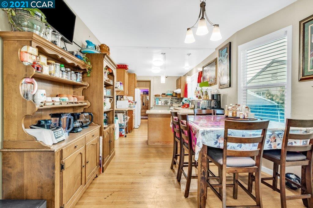 Herbert Guice Way Oakland, CA 94621 - Photo 38 of 40 a dining hall with stainless steel appliances granite countertop a stove and chairs