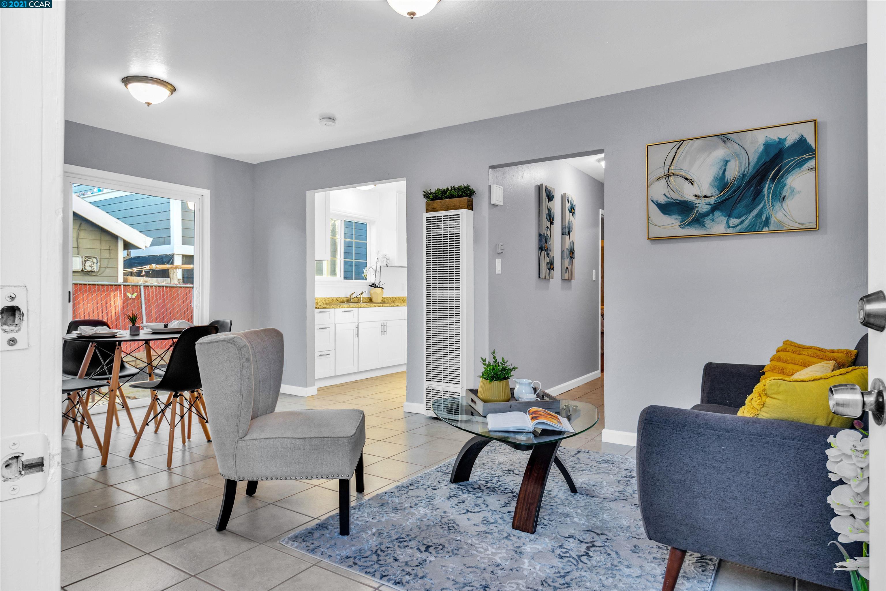 Herbert Guice Way Oakland, CA 94621 - Photo 4 of 40 a living room with furniture and wooden floor