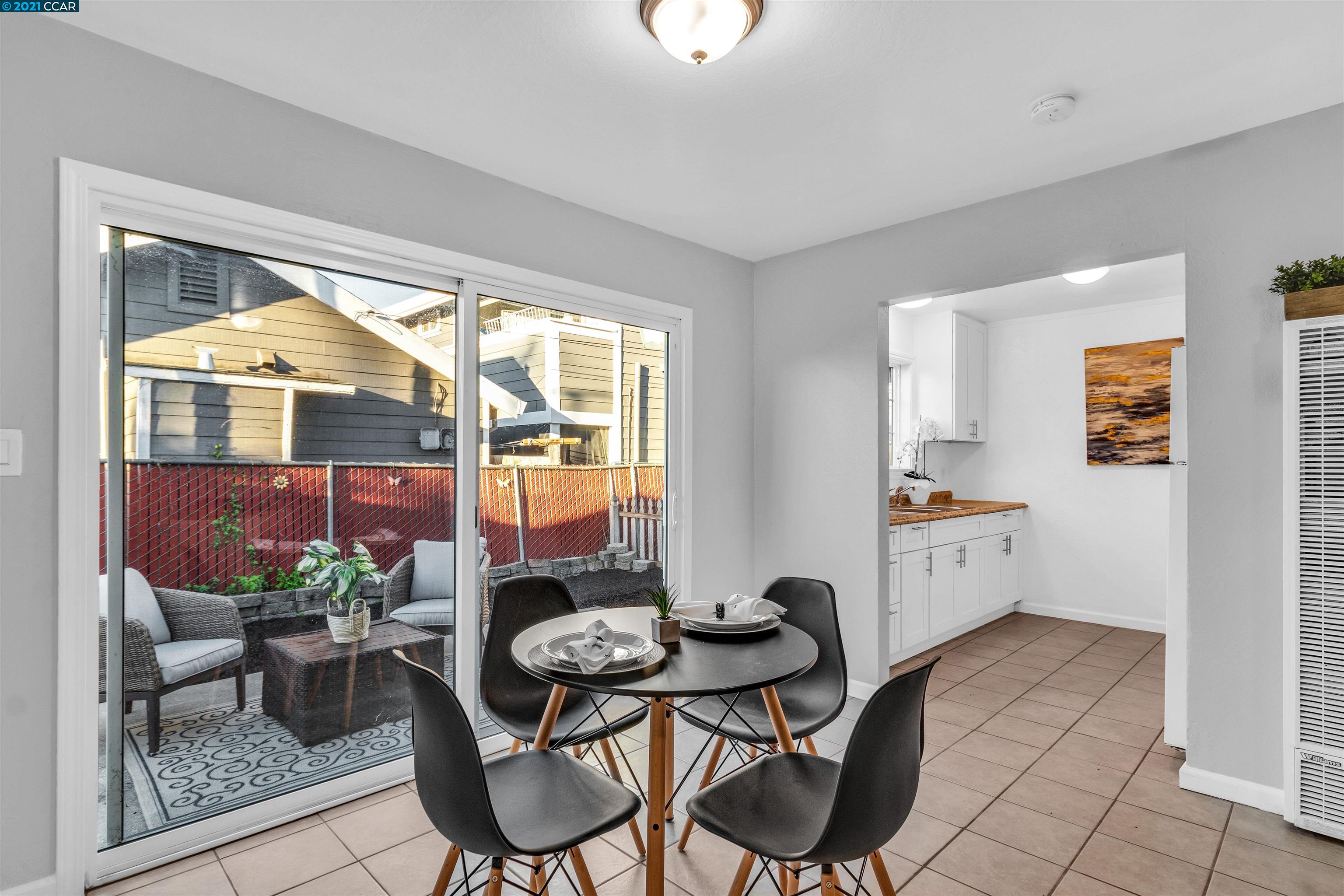 Herbert Guice Way Oakland, CA 94621 - Photo 6 of 40 a dining room with furniture and a floor to ceiling window