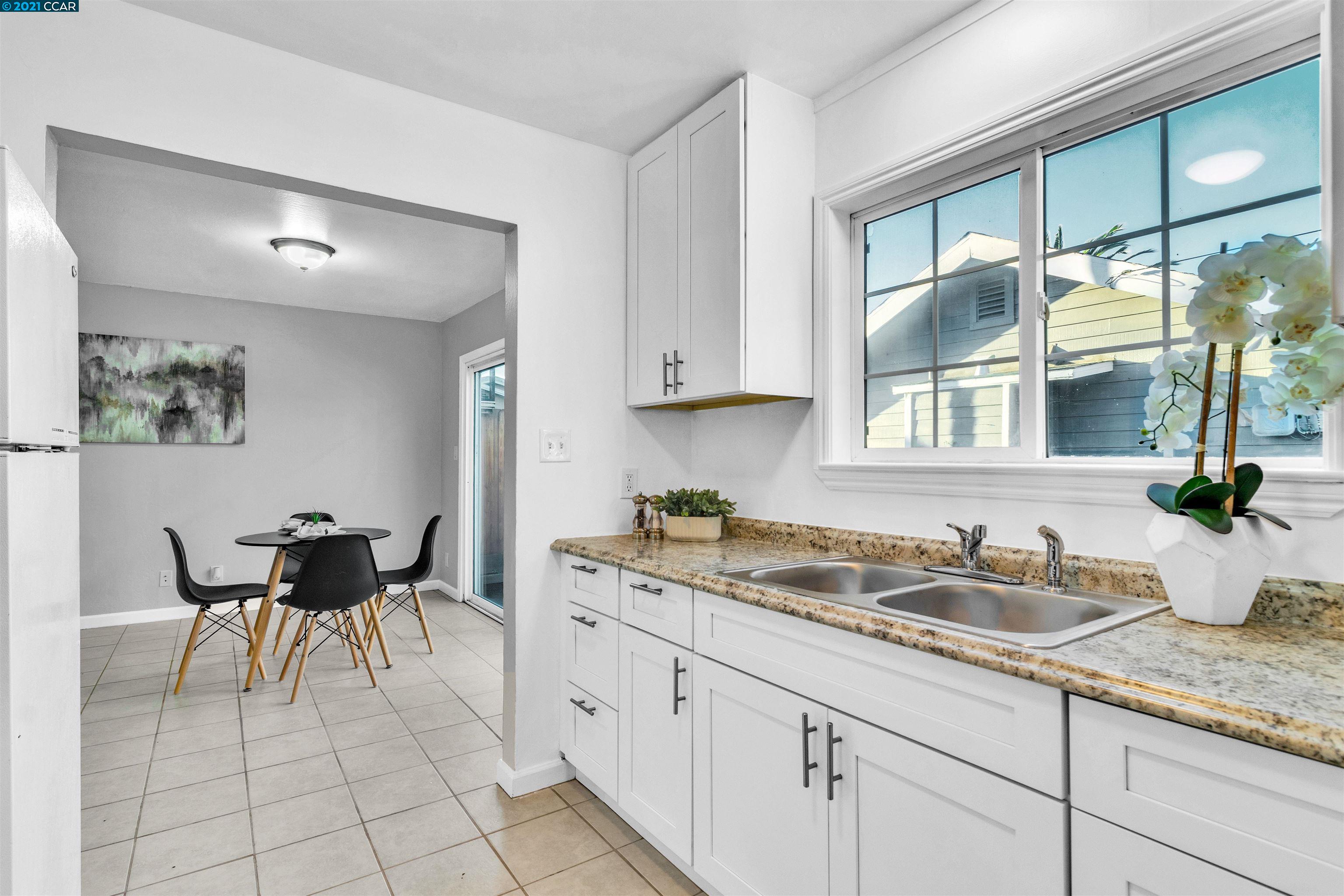 Herbert Guice Way Oakland, CA 94621 - Photo 9 of 40 a kitchen with a sink and cabinets