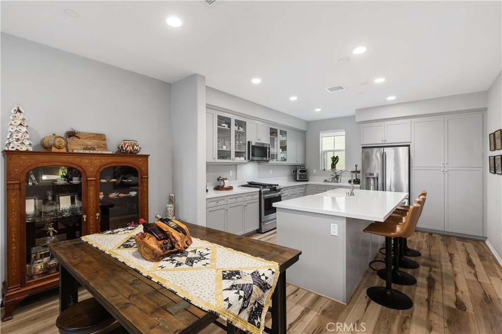 31329 Via Nubes Temecula, CA 92592 - Photo 11 of 45 a living room with stainless steel appliances furniture a dining table and kitchen view