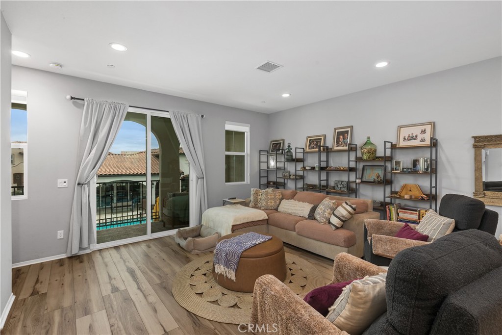 31329 Via Nubes Temecula, CA 92592 - Photo 14 of 45 a living room with furniture and a large window