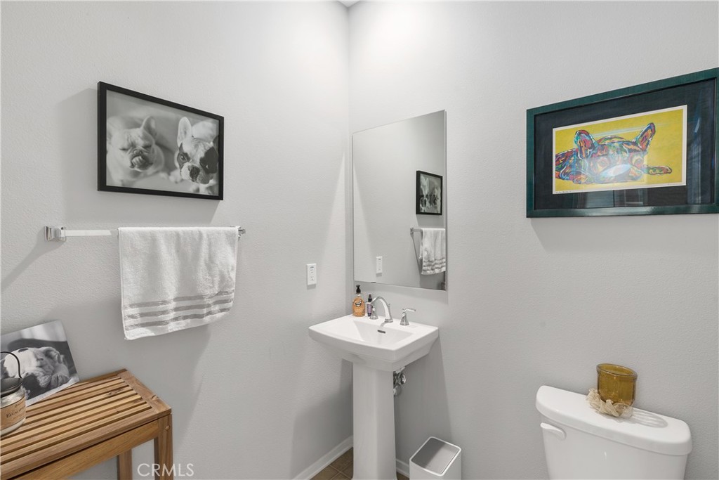 31329 Via Nubes Temecula, CA 92592 - Photo 15 of 45 a bathroom with a toilet a sink and a mirror