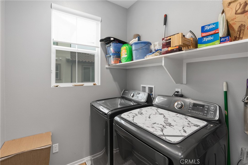 31329 Via Nubes Temecula, CA 92592 - Photo 24 of 45 a utility room with dryer and washer