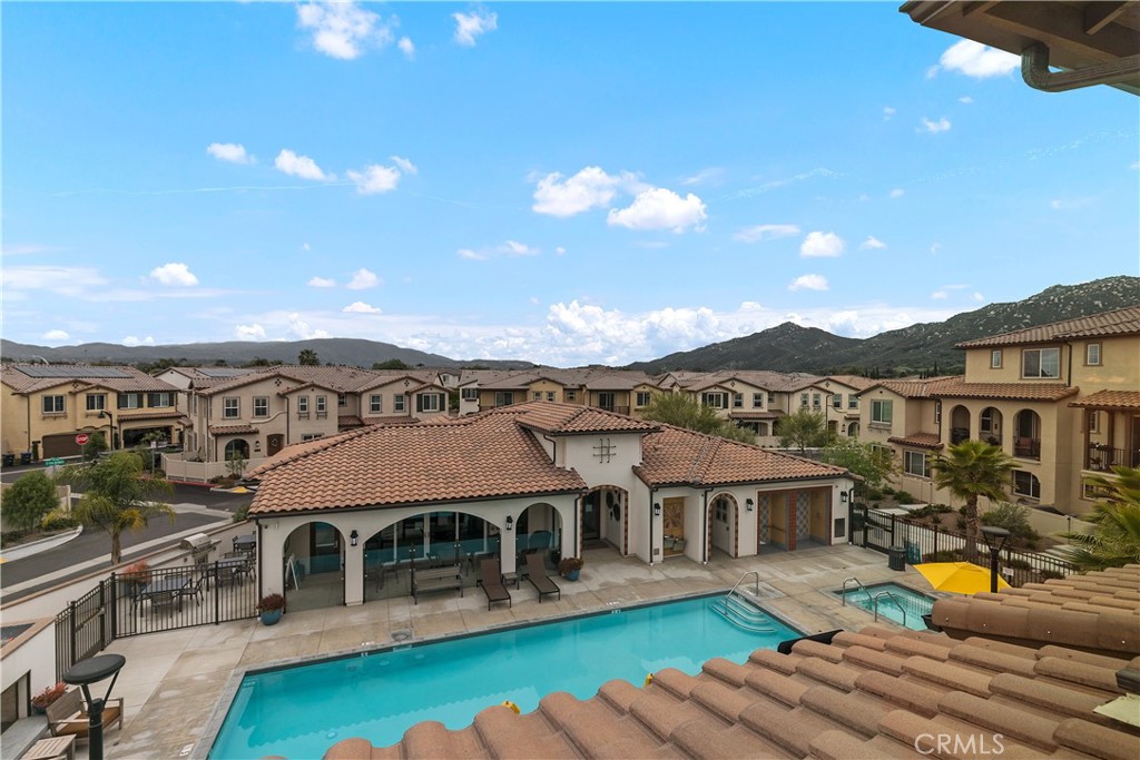 31329 Via Nubes Temecula, CA 92592 - Photo 28 of 45 an aerial view of residential houses with yard and swimming pool