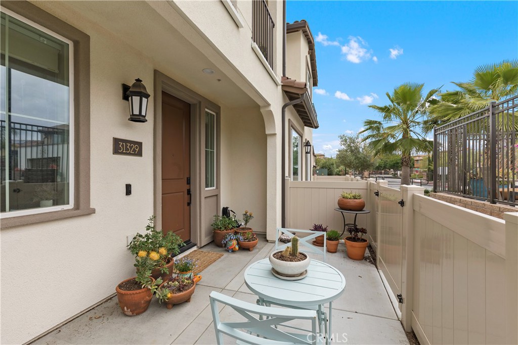 31329 Via Nubes Temecula, CA 92592 - Photo 30 of 45 a view of a patio with couple of chairs and couches with wooden floor