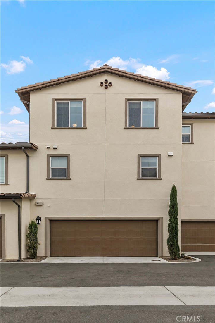 31329 Via Nubes Temecula, CA 92592 - Photo 32 of 45 a front view of a house with a garage