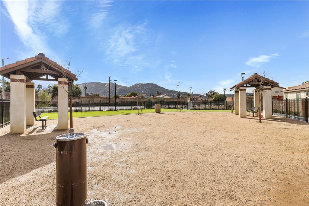 31329 Via Nubes Temecula, CA 92592 - Photo 41 of 45 a front view of a house with a yard and glass top table and chairs
