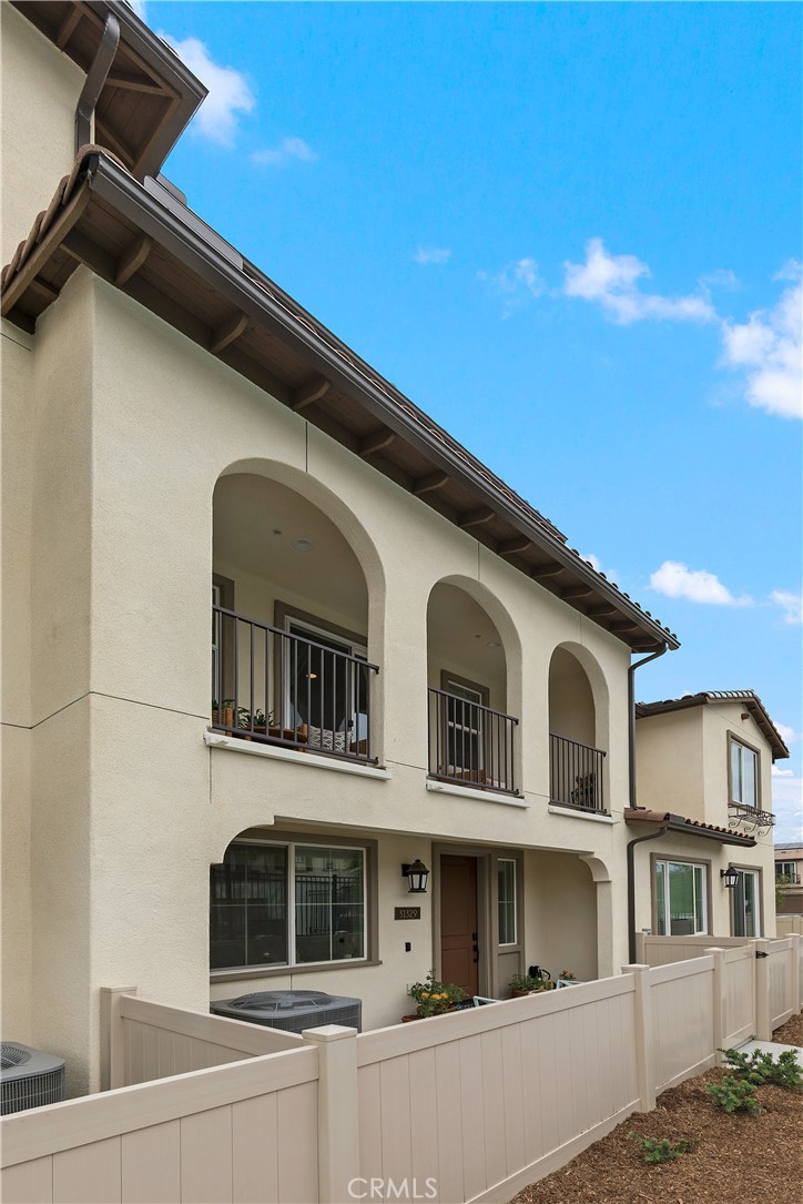 31329 Via Nubes Temecula, CA 92592 - Photo 5 of 45 a front view of a house with balcony