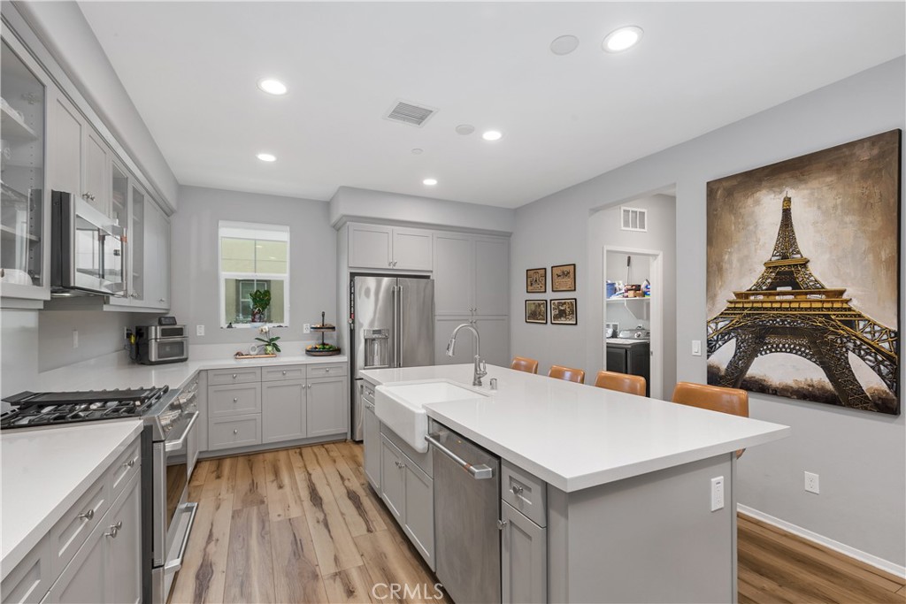 31329 Via Nubes Temecula, CA 92592 - Photo 6 of 45 a kitchen that has a cabinets and a stove