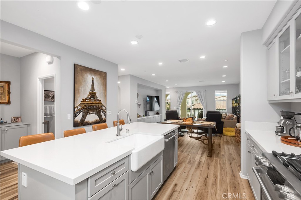 31329 Via Nubes Temecula, CA 92592 - Photo 10 of 45 a large kitchen with sink a stove and refrigerator