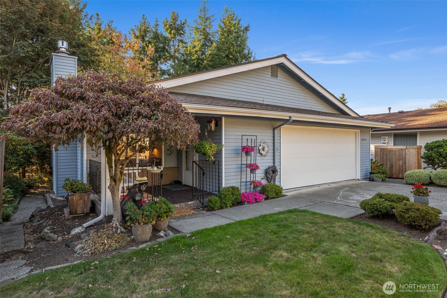 24431 11th Avenue South Des Moines, WA 98198 - Photo 2 of 39 a front view of a house with a yard and garage