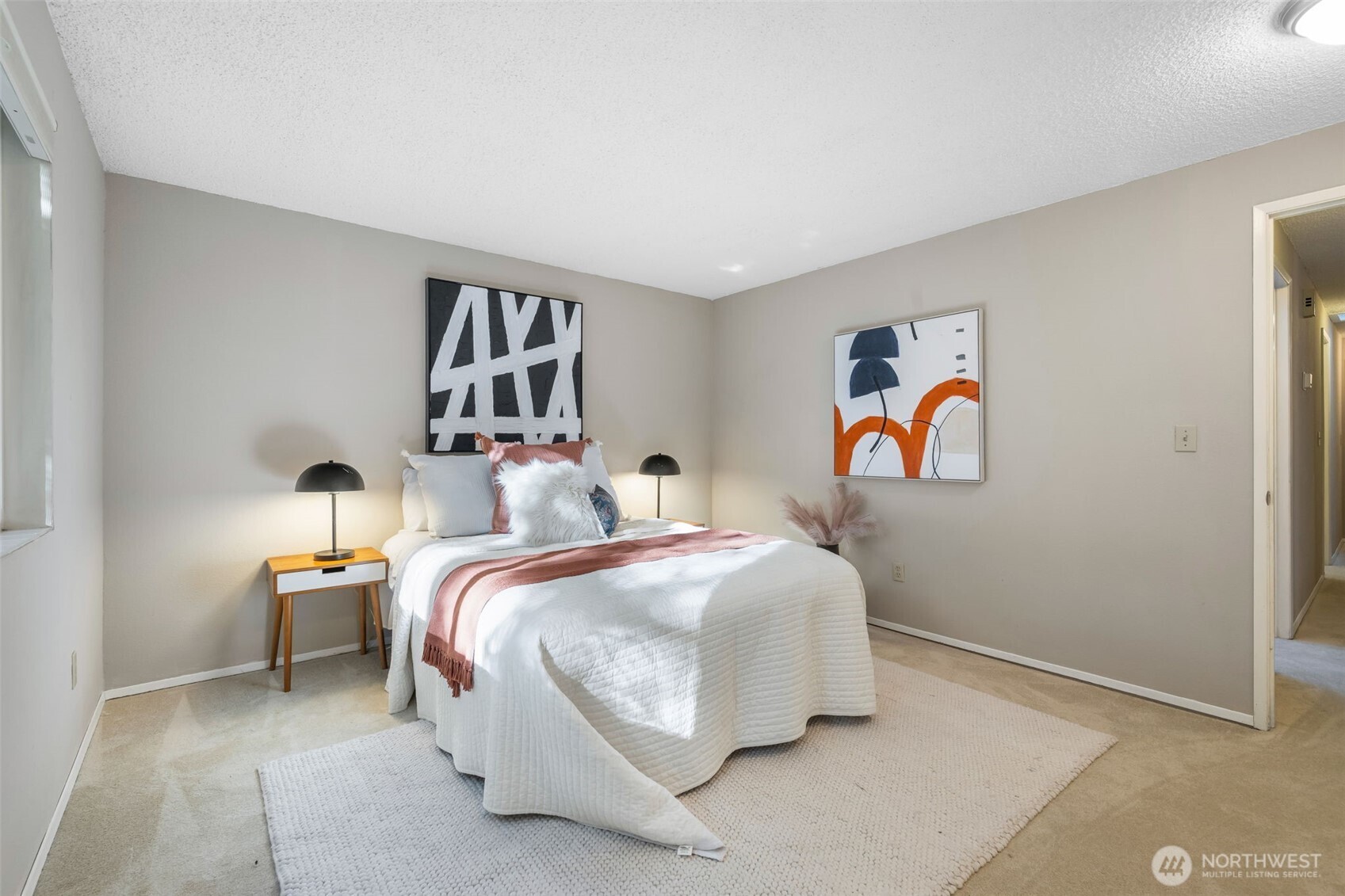 24431 11th Avenue South Des Moines, WA 98198 - Photo 23 of 39 a bedroom with bed and wall painting