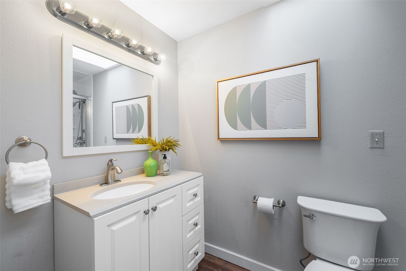 24431 11th Avenue South Des Moines, WA 98198 - Photo 24 of 39 a bathroom with a toilet sink and mirror