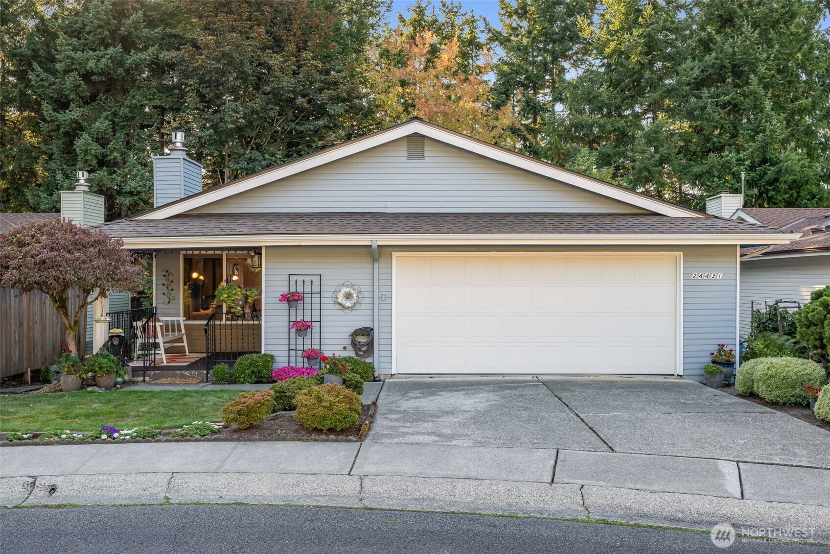 24431 11th Avenue South Des Moines, WA 98198 - Photo 32 of 39 a front view of house with garage and yard