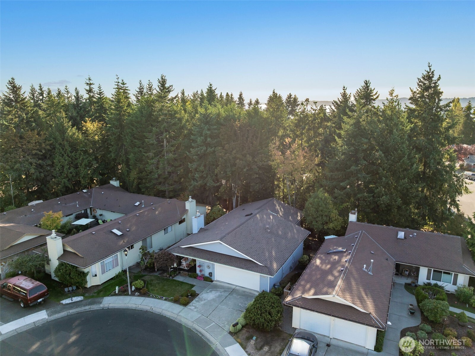 24431 11th Avenue South Des Moines, WA 98198 - Photo 36 of 39 an aerial view of a house with outdoor space and trees all around
