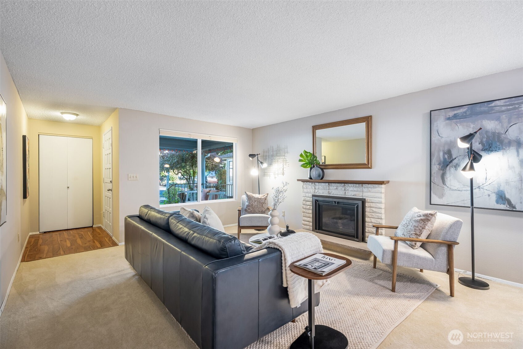24431 11th Avenue South Des Moines, WA 98198 - Photo 5 of 39 a living room with furniture and a fireplace