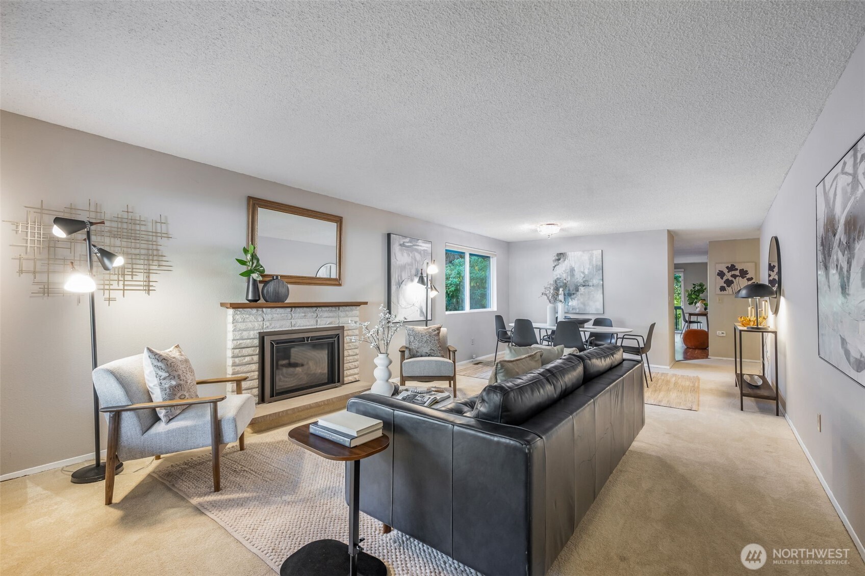 24431 11th Avenue South Des Moines, WA 98198 - Photo 6 of 39 a living room with furniture and a fireplace
