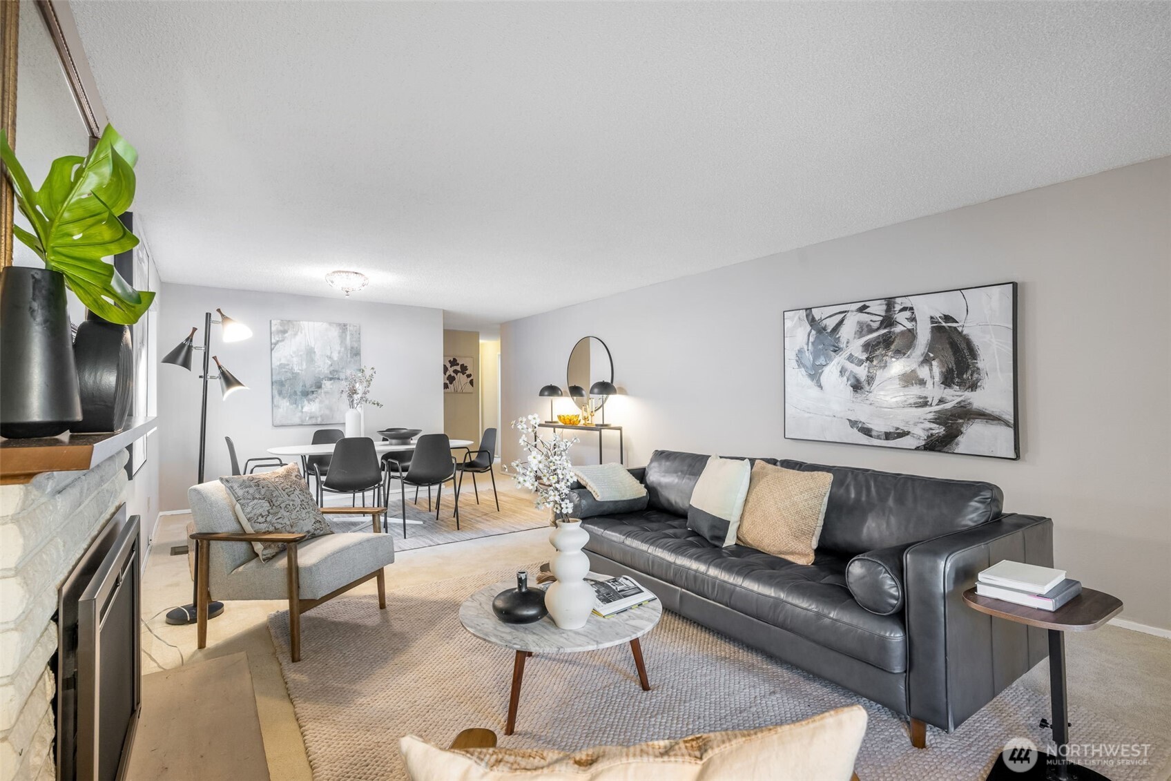 24431 11th Avenue South Des Moines, WA 98198 - Photo 7 of 39 a living room with furniture a rug and a flat screen tv