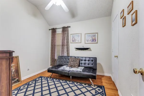 a living room with furniture and a rug