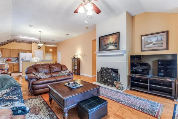 a living room with furniture and a fireplace