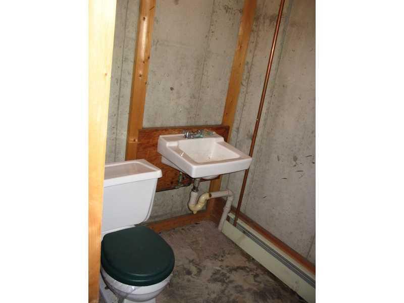 93 Fowler Road Orrington, ME 04474 - Photo 32 of 35 Bathroom. A half-bath is located off...