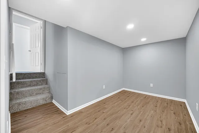 a view of wooden floor in an empty room