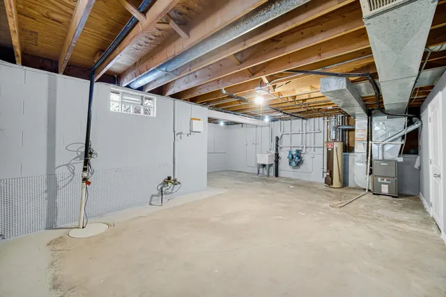 a view of a house with snow on the road