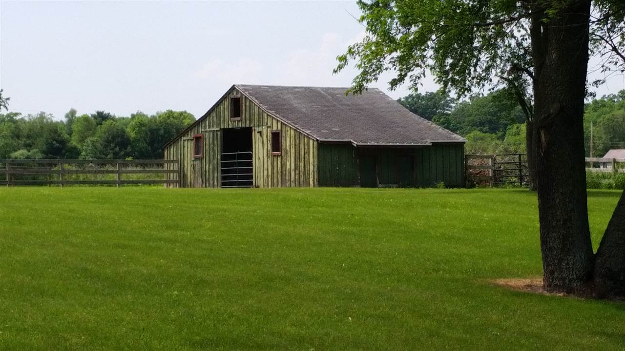 16844 Wheeler Road Durand, IL 61024 - Photo 15 of 22 a front view of a house with yard and green space