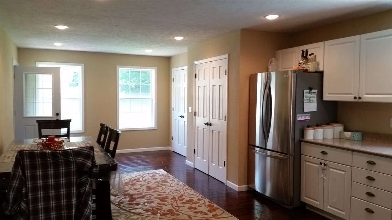 16844 Wheeler Road Durand, IL 61024 - Photo 5 of 22 a kitchen with stainless steel appliances granite countertop a refrigerator stove and sink