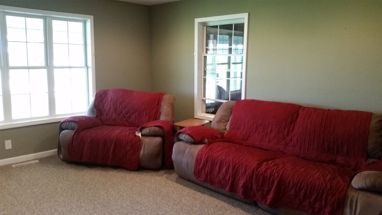 16844 Wheeler Road Durand, IL 61024 - Photo 8 of 22 a living room with furniture and a window