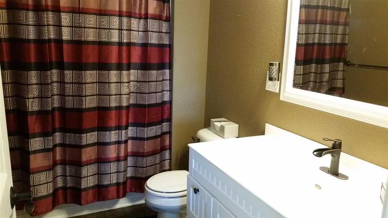 16844 Wheeler Road Durand, IL 61024 - Photo 9 of 22 a bathroom with a sink a toilet and shower