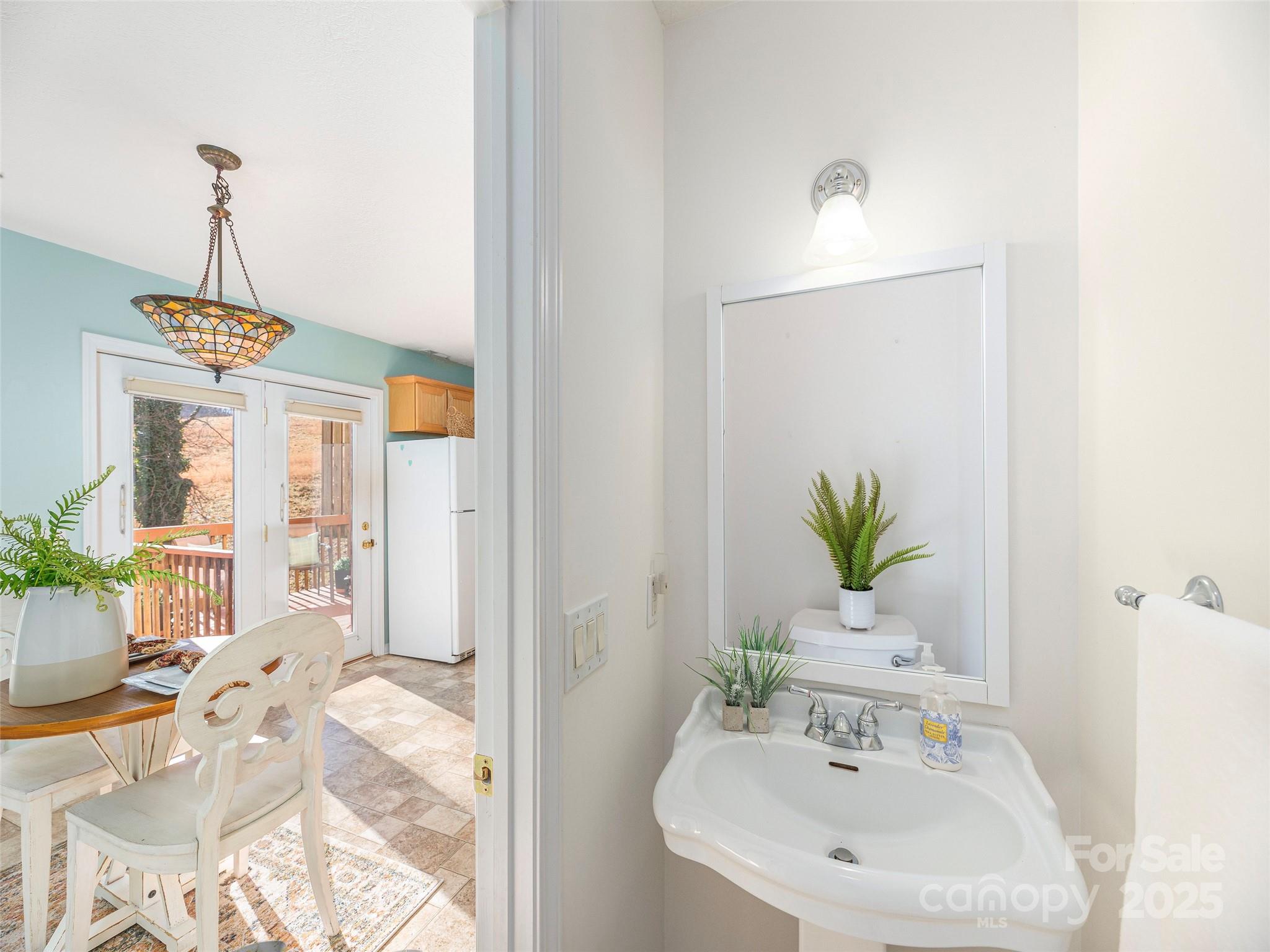 53 Vancott Court Clyde, NC 28721 - Photo 14 of 23 a bathroom with a sink and a mirror