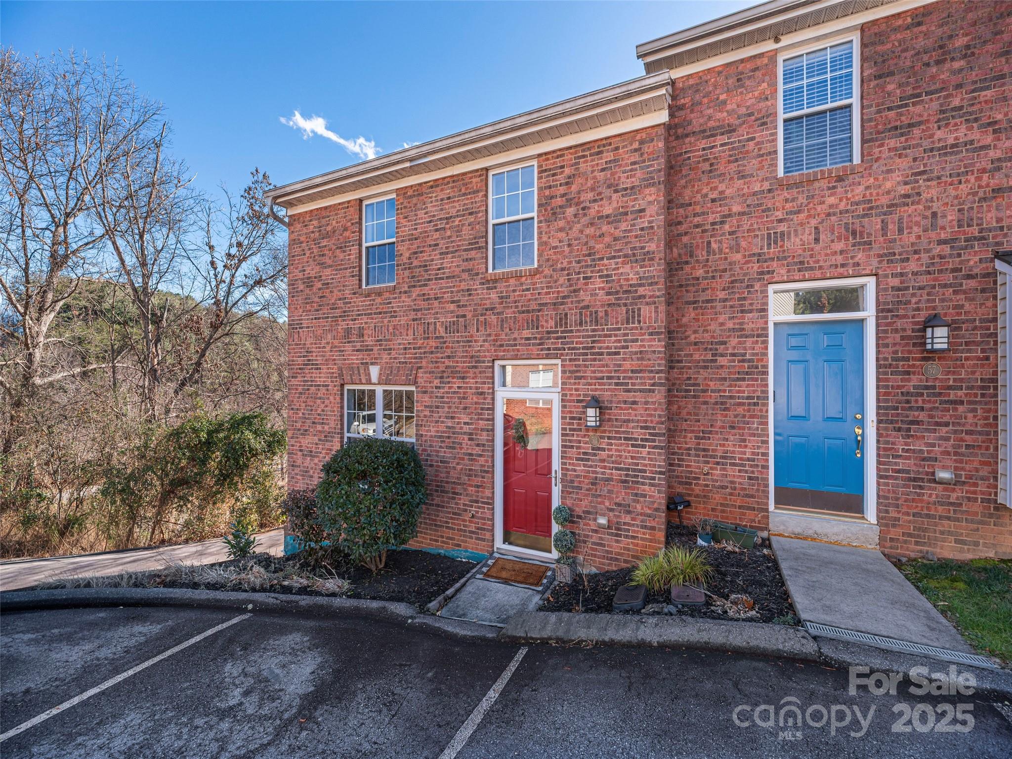 53 Vancott Court Clyde, NC 28721 - Photo 2 of 23 a front view of a house with garden