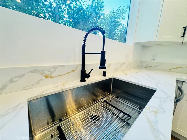 a backyard with a sink and a stove top oven