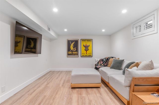 a bedroom with a bed and a couch