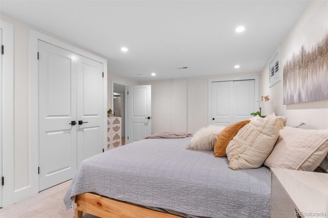 a bedroom with a bed and a walk in closet