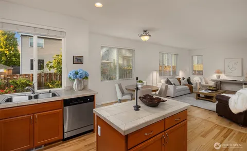 a living room with furniture a window and a sink
