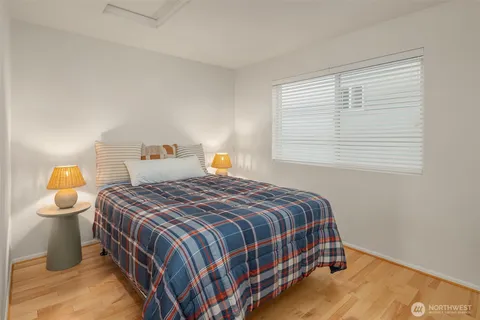 a bedroom with a bed and window