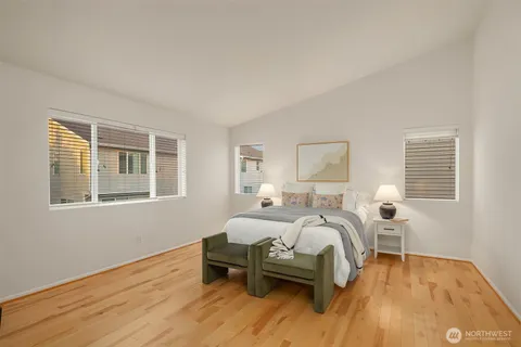 a bedroom with furniture and a window